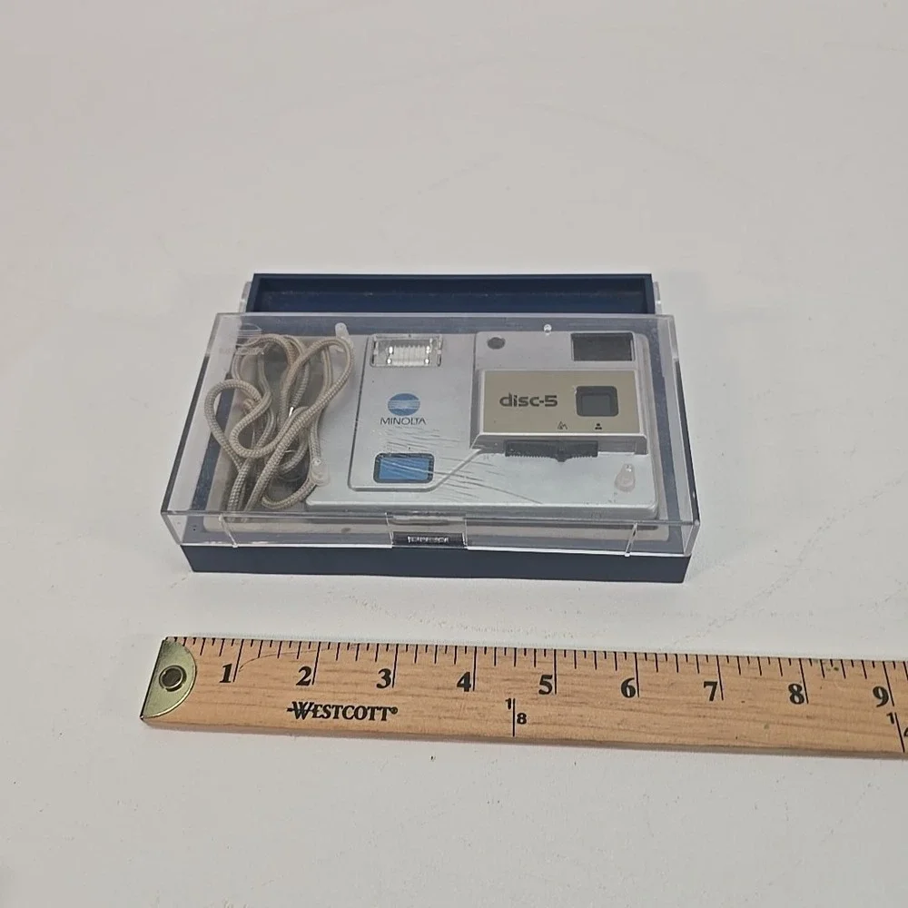 Minolta Disc‎ 5 Disc Film Camera, silver, with Case